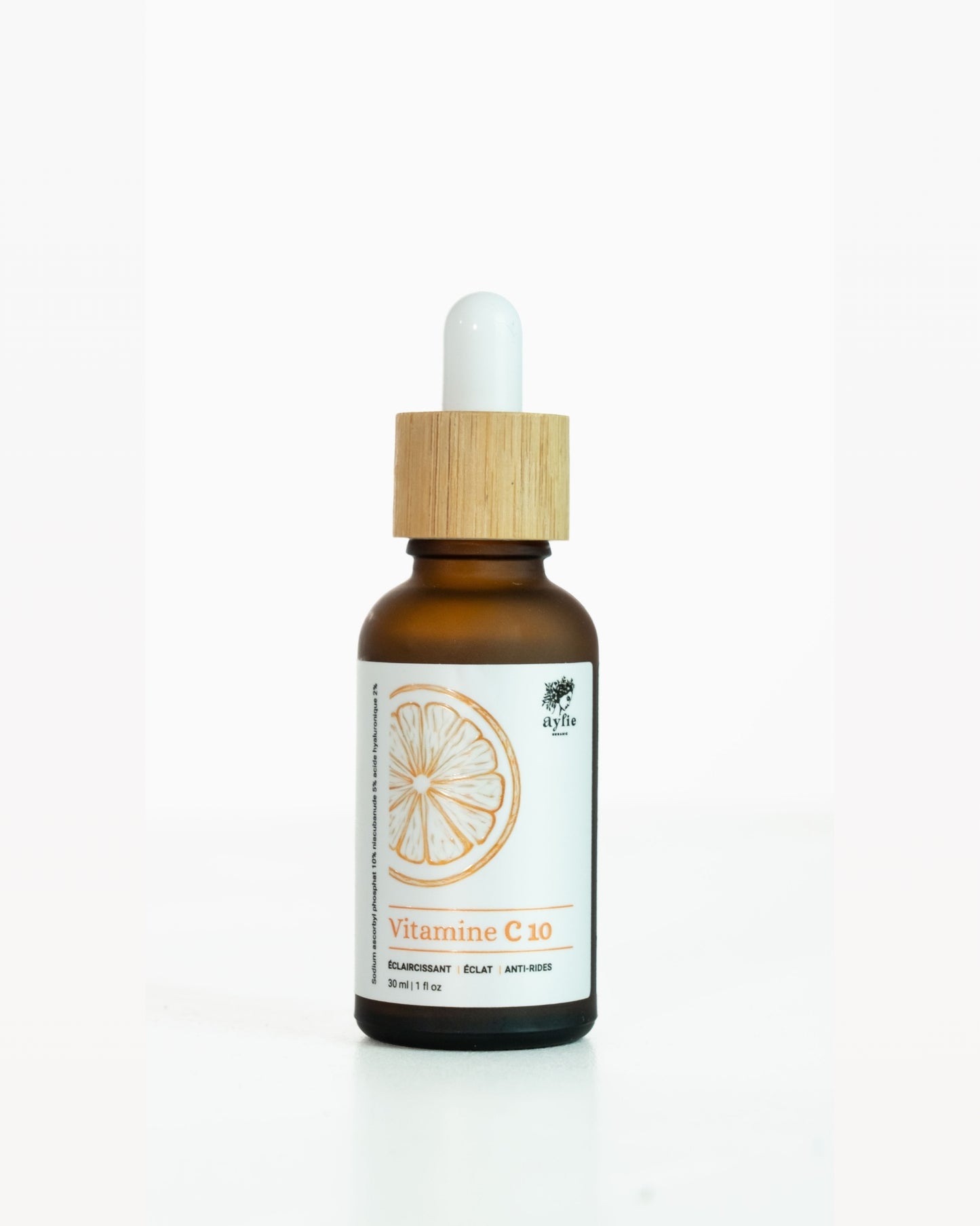 Vitamin C serum bottle with dropper on a white background